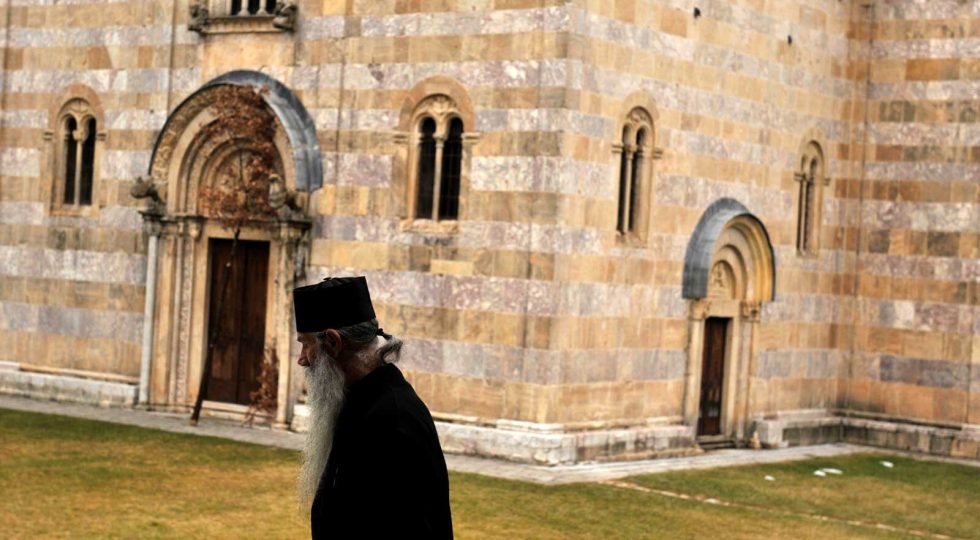 A Serbian Orthodox monk walks outside the Visoki Decani Monastery prior to the visit of Serbian President in Decani on January 6, 2012. Serbian President Boris Tadic offerred a "message of peace" to Kosovo upon arriving at a monastery where he will spend Orthodox Christmas with monks and minority Serbs in the breakaway territory. AFP PHOTO/ ARMEND NIMANI (Photo credit should read ARMEND NIMANI/AFP/Getty Images)